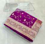 Royal purple premium Banarasi silk saree with intricate golden jaal design and rich copper-gold zari border, handwoven in Banaras.