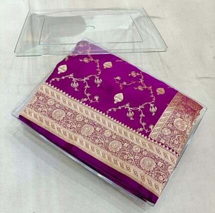 Royal purple premium Banarasi silk saree with intricate golden jaal design and rich copper-gold zari border, handwoven in Banaras.