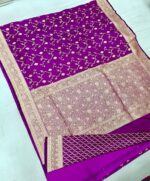 Royal purple premium Banarasi silk saree with intricate golden jaal design and rich copper-gold zari border, handwoven in Banaras.